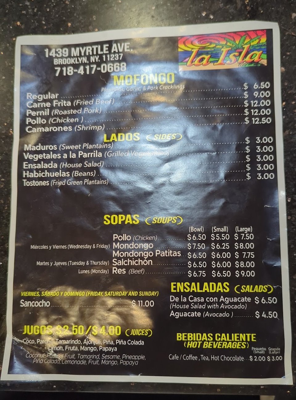 Counter menu with sides and per-pound options.